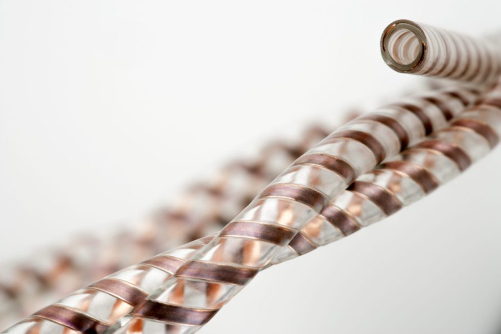 clear tubing with flat wire embedded in the tube wall eTubing