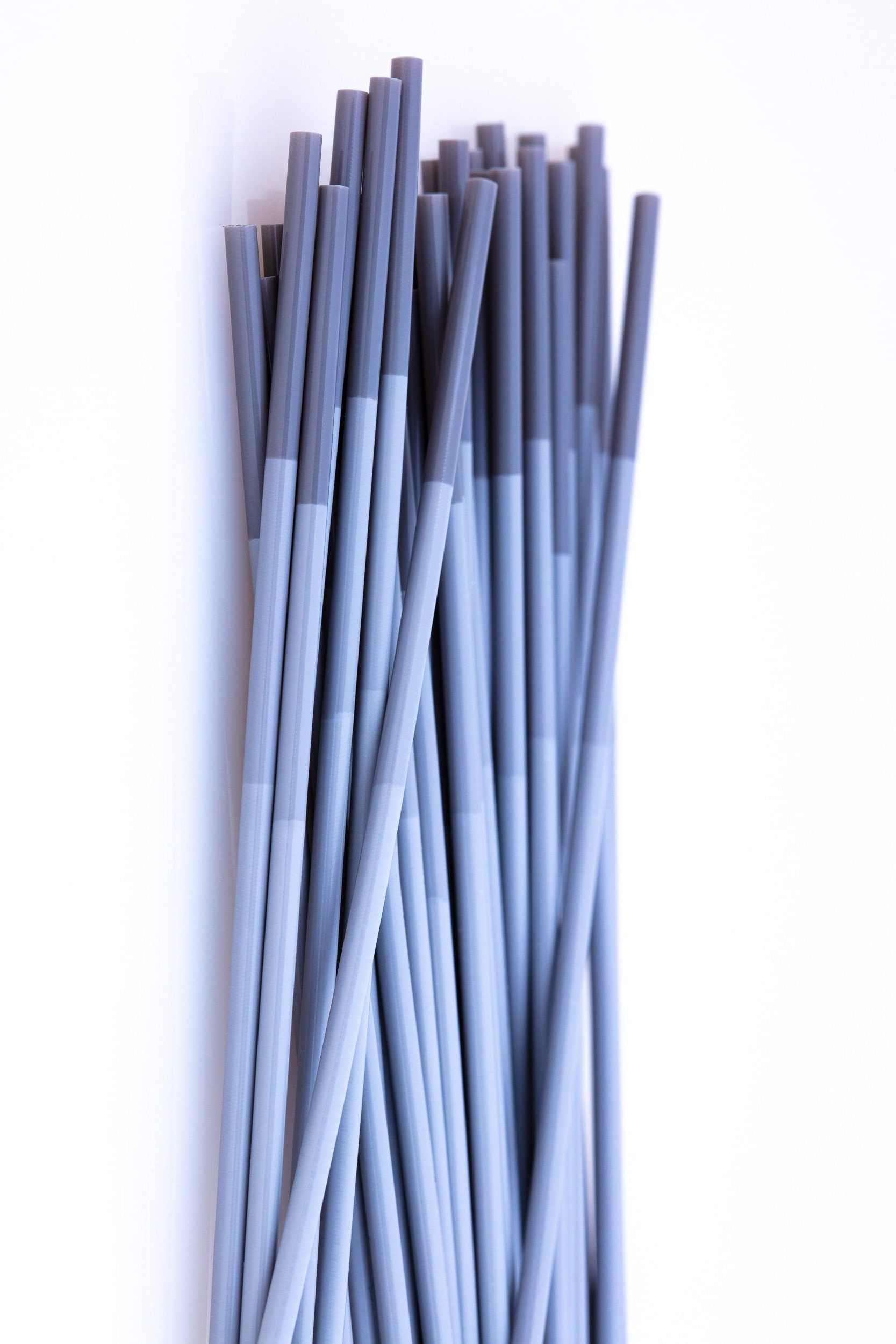 stack of gray multi-durometer tubes