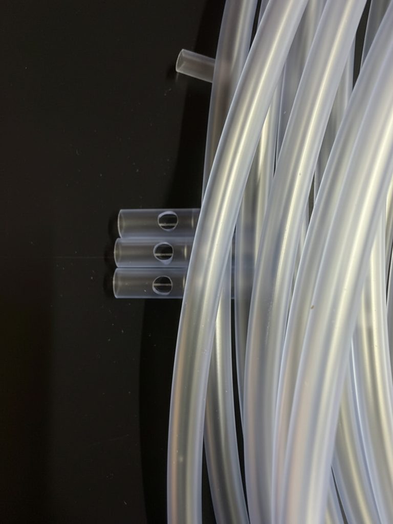 clear tube with laser drilled hole